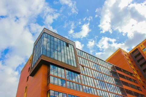 Building on background sky with clouds. .against the sky a new high-rise buil Stock Photos
