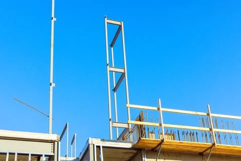 As a building is being constructed, metal structures made of steel beams are Photos