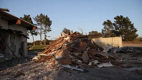 Building being piled into trash Stock Footage 94694930