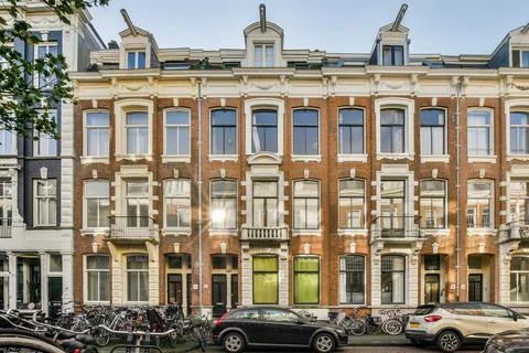 A building with bikes parked in front of it Stock Photos