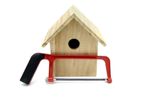 Building bird nesting box with nails and saw Stock Photos
