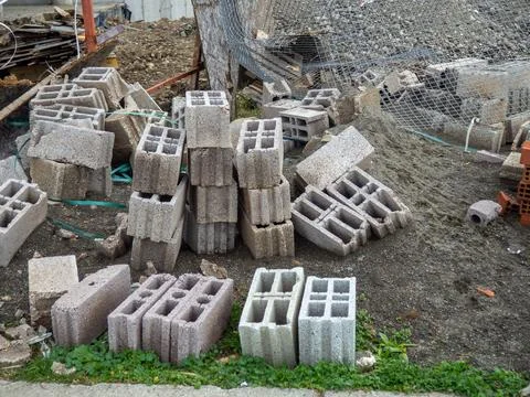 Building blocks on the ground. Material for the construction of warm houses.. Stock Photos