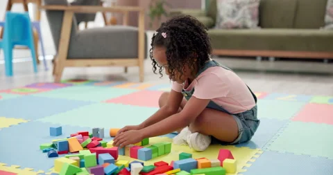 Building blocks, playing and child on floor in house for cognitive development Stock Footage 308515106