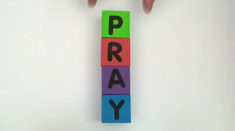 BUilding blocks spell PRAY Stock Footage