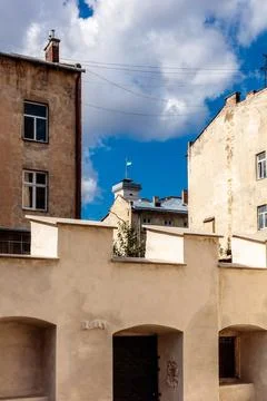 A building with a blue flag on top Fotos de archivo