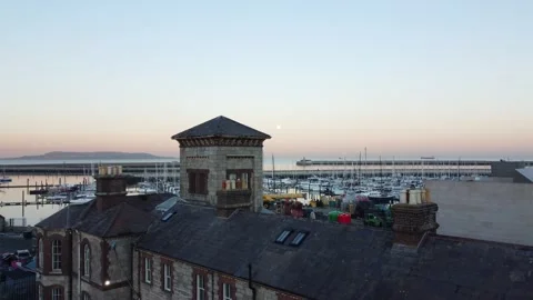 Building with boats moored in the background Stock Footage 171594192