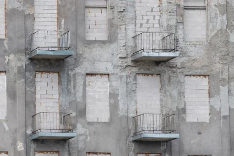 Building with brick-built windows. abandoned building. Stock Photos