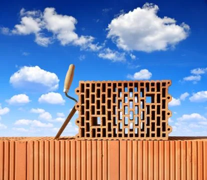 Building a brick wall. Stock Photos