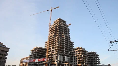 Building a building the sun Stock Footage 4541659