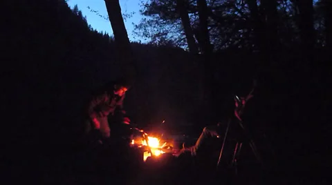 Building a Campfire at Night Stock Footage 22899995