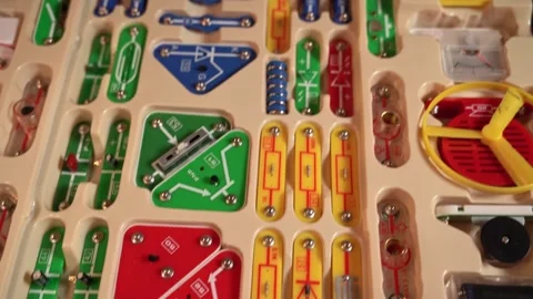 Building circuits with a basic electronics kit in a hands-on activity at home Stock Footage 324523446