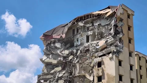 Building collapses in a city, capturing the aftermath of a major structural.. Stock Footage 337957488