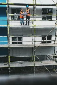 Building commitment within their team. a young man and woman going over building Foto stock