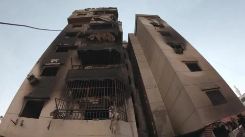 A building completely burned down as a result of the Israeli shelling on the Stock Footage 289846462