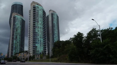 Building Complex, street level view with threatening clouds. Stock Footage 79811085