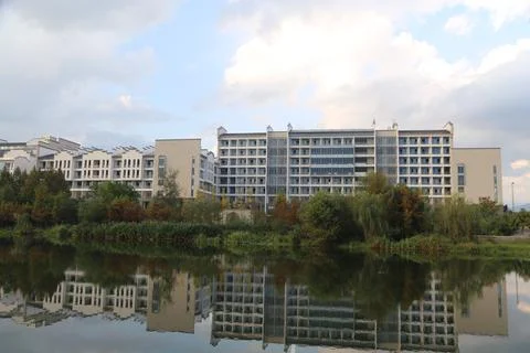 The building complex of the student dormitory at a lake Stock Photos