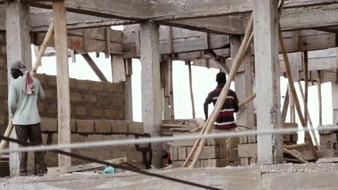 Building constructers working at a construction site  Stock Footage 199309107