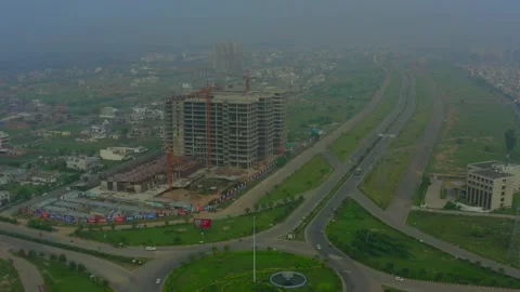 Building construction and Circular road top view at the city in india Stock Footage 221736770