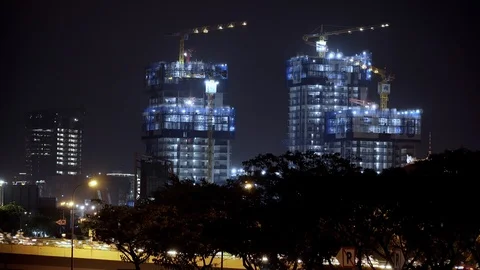 Building Construction with Busy Traffic at Night Stock Footage 118640930