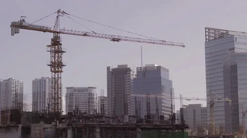 Building Construction with crane and workers on top Vídeo Stock 79299038