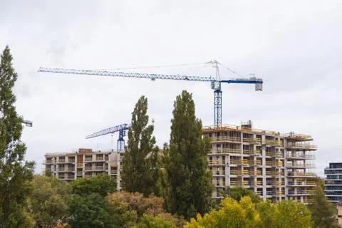 Building construction with crane in the city Stock Photos