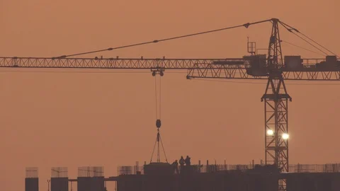 The building with construction crane. Evening time Stock Footage 118861586