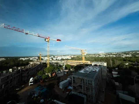 Building Construction with cranes are working in the construction site, Con.. Stock Photos