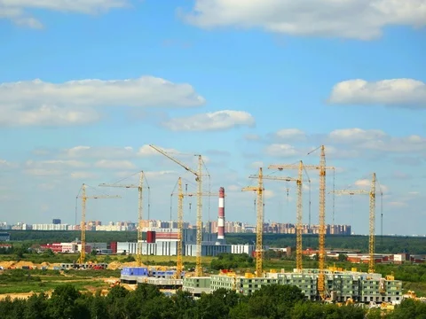 Building construction in a day time with many cranes on horizon Time lapse Stock Footage 79068448
