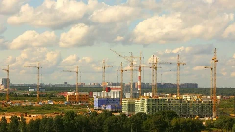 Building construction in a day time with many cranes on horizon Time lapse Stock Footage 79323807