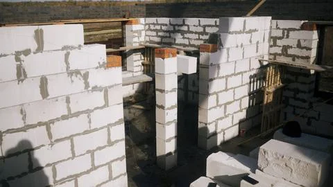 Building construction developing house walls with aerated concrete blocks Stock Photos
