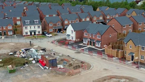 Building construction development site aerial circling across the new houses Stock Footage 342410156