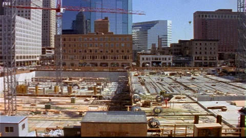Building Construction downtown square block foundation Stock Footage 145779138