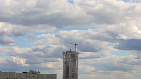 BUILDING CONSTRUCTION. Isolated. With a working crane on the roof of a Stock Footage 207869339
