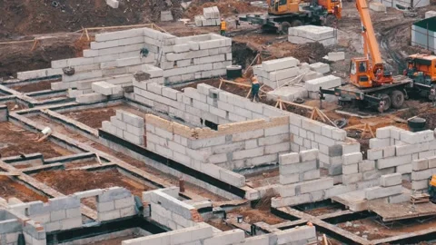 Building construction process. Foundation laying Stock Footage 105960212