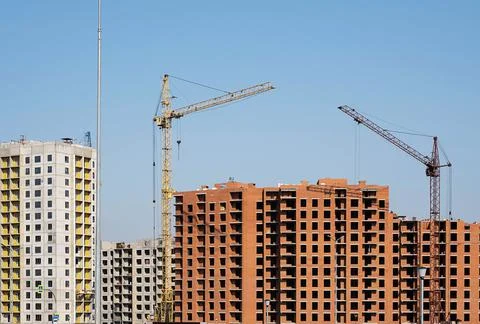 Building construction site with cranes. Stock Photos