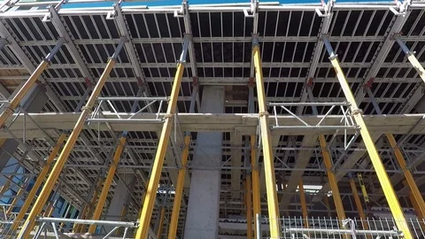 Building construction site ground level viewed through metal fence, barricade Stock-Footage 99425872