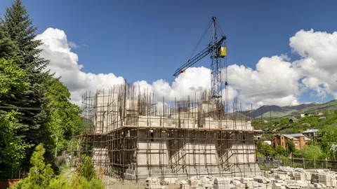 Building construction site with large crane at an outdoor site in Dilijan Stock Footage 241323521