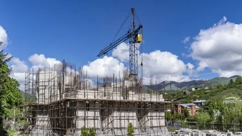 Building construction site with large crane at an outdoor site in Dilijan Stock Footage 241323976
