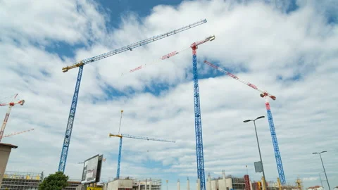 Building construction site with moving cranes, moving clouds. Time Stock Footage 153660005