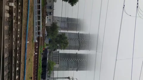 Building construction view through train window Stock Footage 264893881