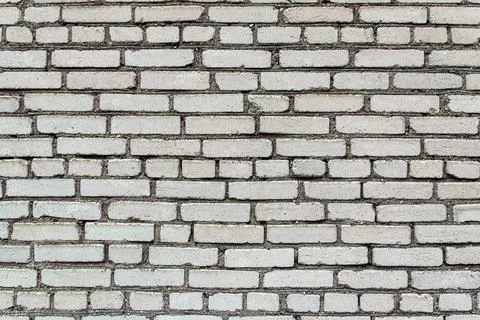 Building construction: white brick wall texture - stained bricks bonded with  Fotos de archivo