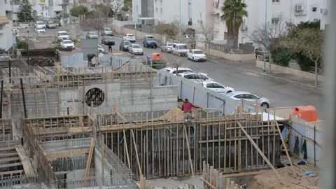Building construction work. worker without safety helmet. no face view from back Видео 232945814