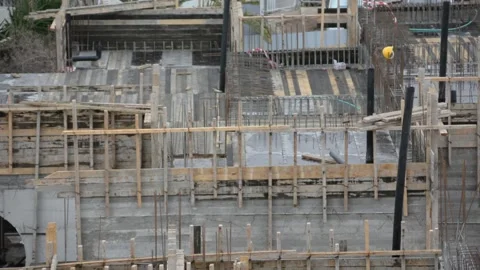 Building construction work. yellow safety helmet on the construction  Video stock 232945841