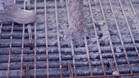 Building construction worker pouring cement on concrete Stock Footage 81537428