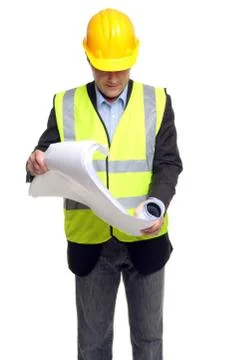 Building contractor in safety gear with plans Stock Photos