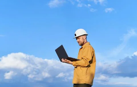 Building contractor using laptop at construction site Stock Photos