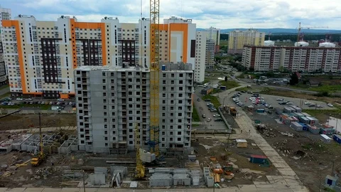 Building crane and building under construction. Construction site. Construction Stock Footage 113579322