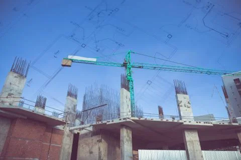 Building crane and construction site under blue sky Ilustración de archivo