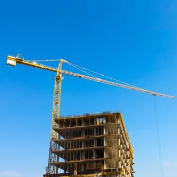 Building crane on construction Stock Photos