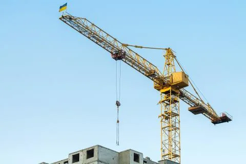 Building crane with flag. Stock Photos
